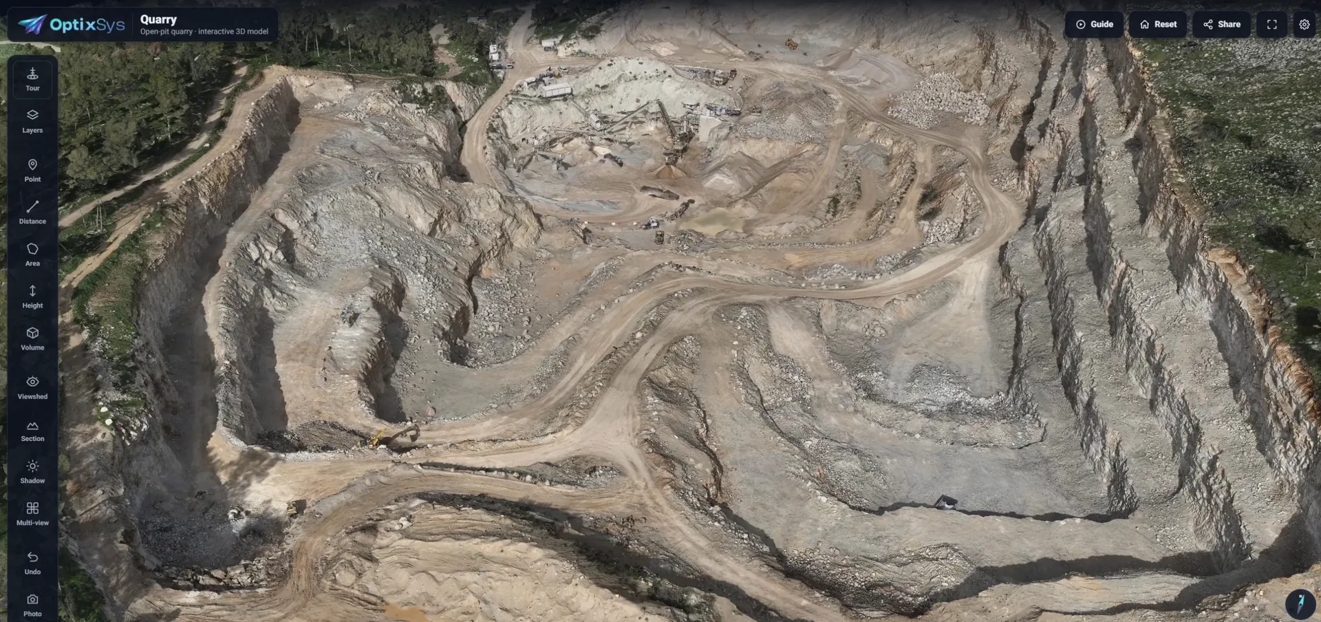 The OptixSys viewer showing an open-pit quarry, with the toolbar on the left and Guide and Share buttons at the top right